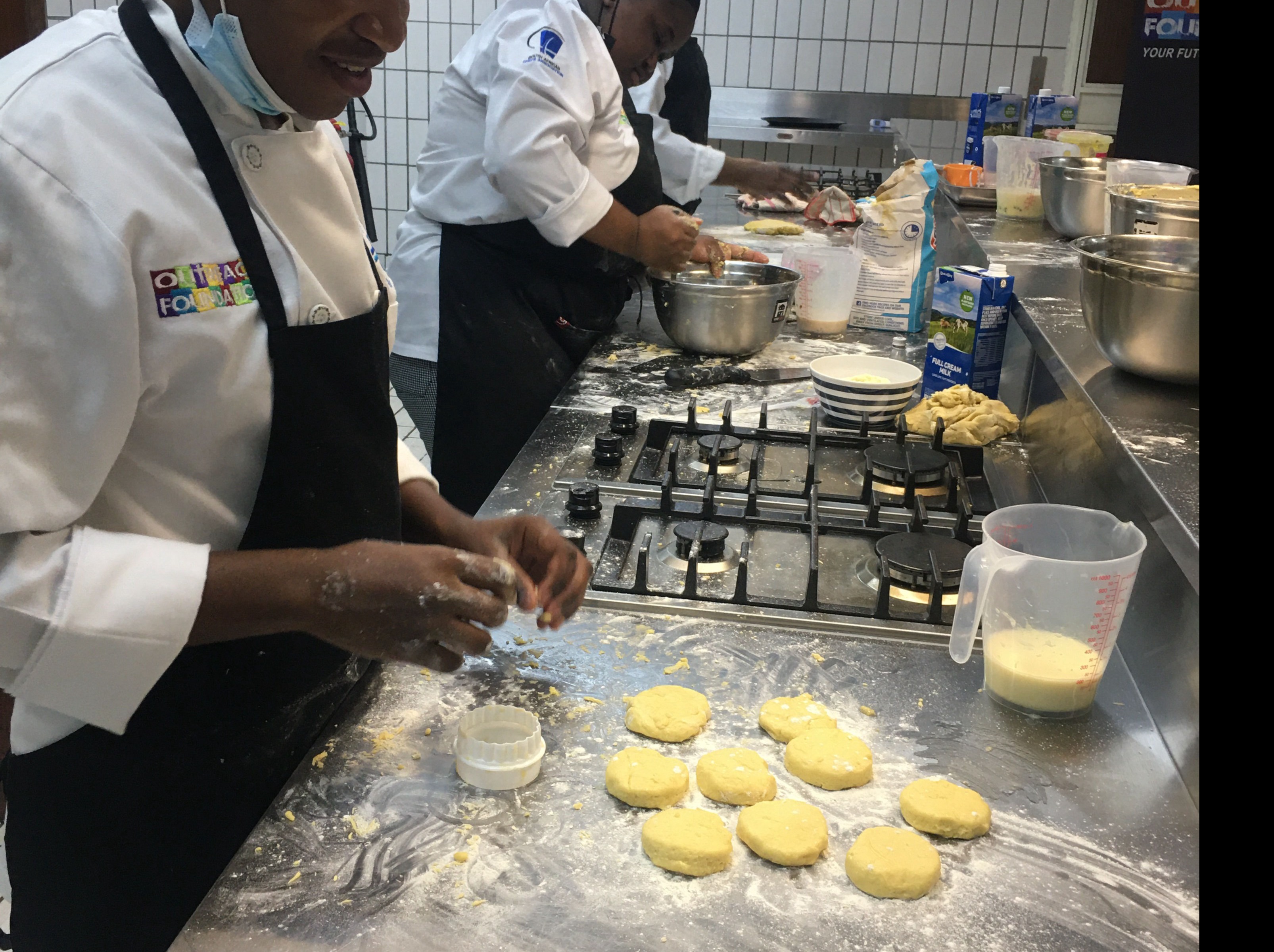 Students busy in the Outreach Foundation teaching kitchen learning valuable baking skills
